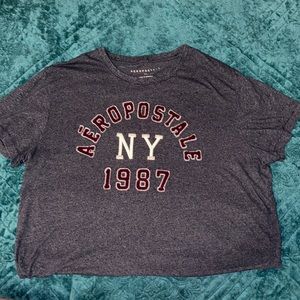 -Blue Aeropostale shirt with red and white embroidery brand title on front